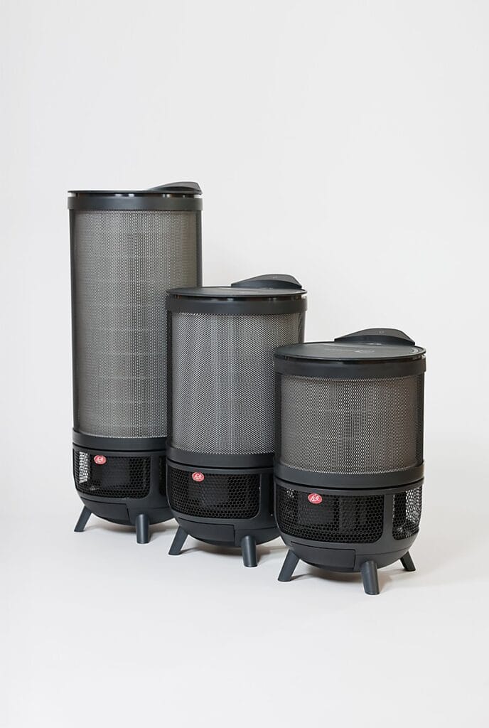 Aeroguard 360 PRO & Premium Three modern, cylindrical electric heaters of varying heights in black and grey, each with a mesh exterior and a red circular button, are displayed alongside the Aeroguard 360 PRO & Premium air purifier by Lux against a plain white background.